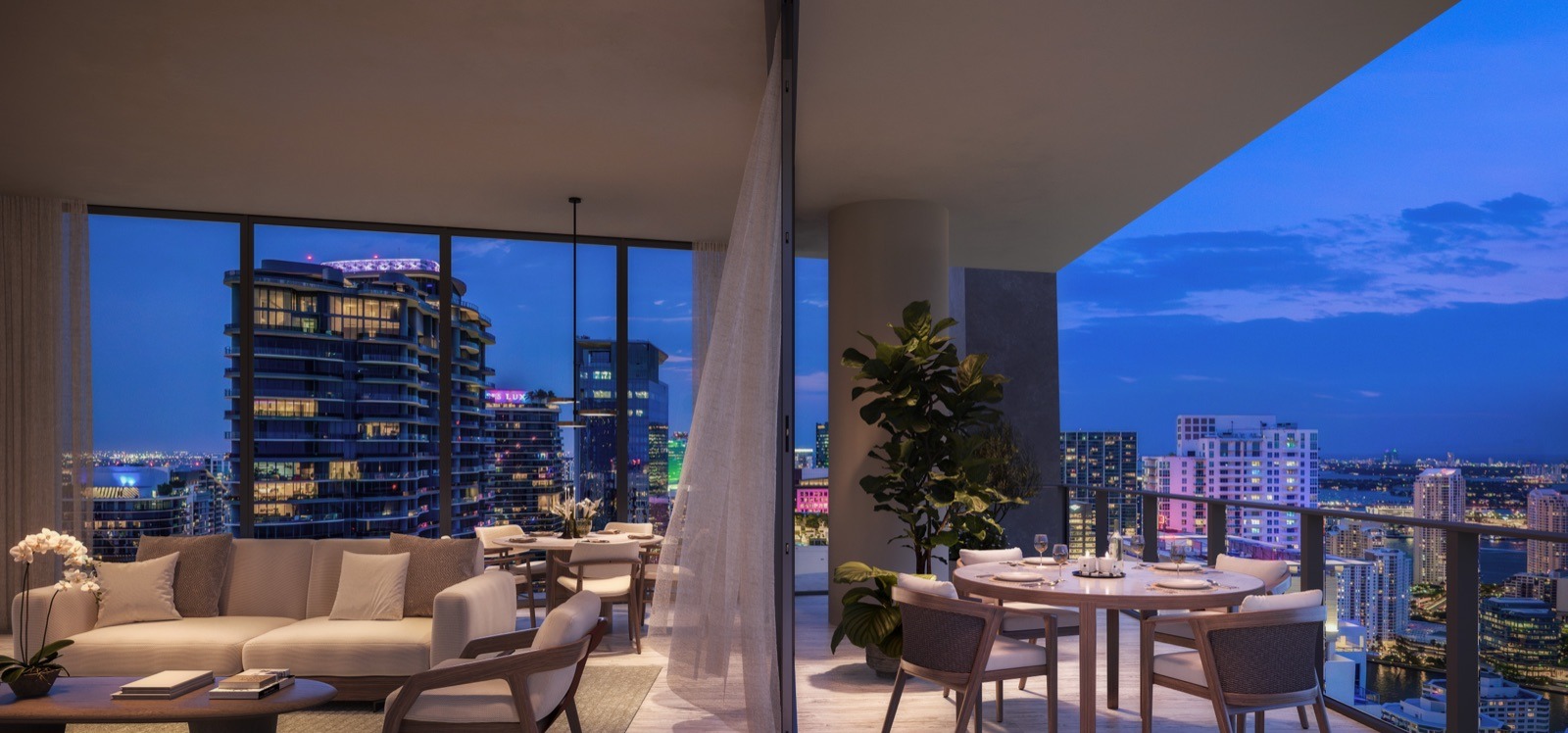 ORA by Casa Tua residence — living, opening onto a generous private terrace with glass railing.